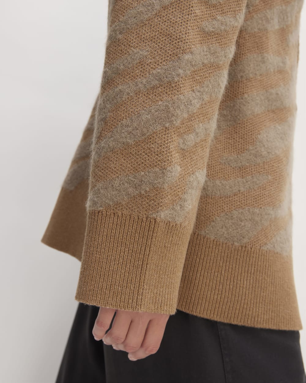 The Alpaca Tiger Jacquard Cardigan in Camel / Medium Brown — detail view